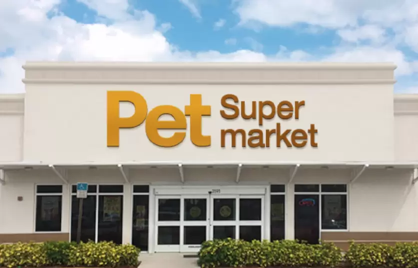 A Pet Supermarket store front on a sunny day.