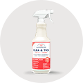 A spray bottle of Natural Care Flea & Tick Spray for dogs.
