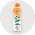 A bottle of TropiClean Natural Flea & Tick Dog Shampoo.