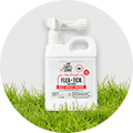 A jug of Skout's Honor Flea + Tick Yard Spray on grass.