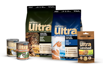Performatrin Ultra pet food products displayed, including cans and bags.